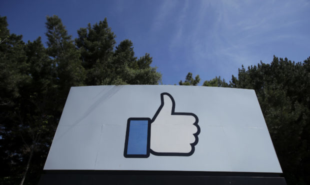 FILE - In this April 14, 2020 file photo, the thumbs up Like logo is shown on a sign at Facebook he...
