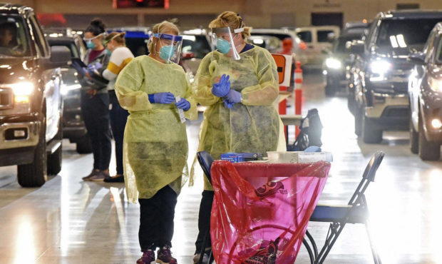 FILE - In this Sept. 8, 2020, file photo, Bismarck-Burleigh Public Health nurses Crys Kuntz, left, ...