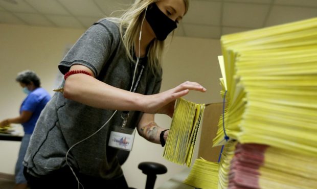 Caitlin Mullen organizes primary ballots at the Salt Lake County Government Center in Salt Lake Cit...