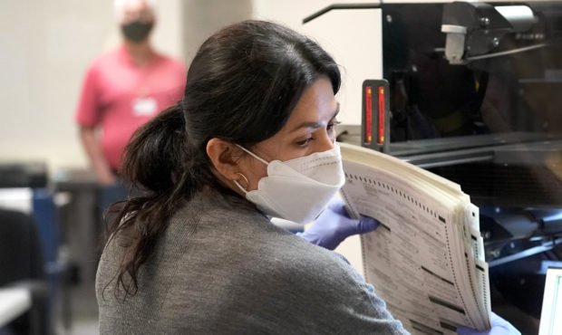 Maricopa County elections officials count ballots, Wednesday, Nov. 4, 2020, at the Maricopa County ...