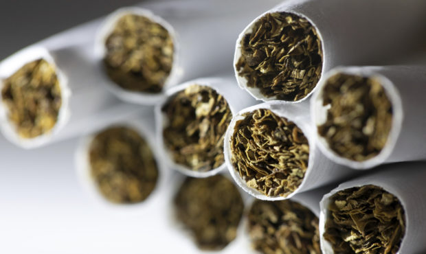 FILE - This Dec. 17, 2019 photo shows a group of cigarettes in New York.  About 14% of U.S adults w...