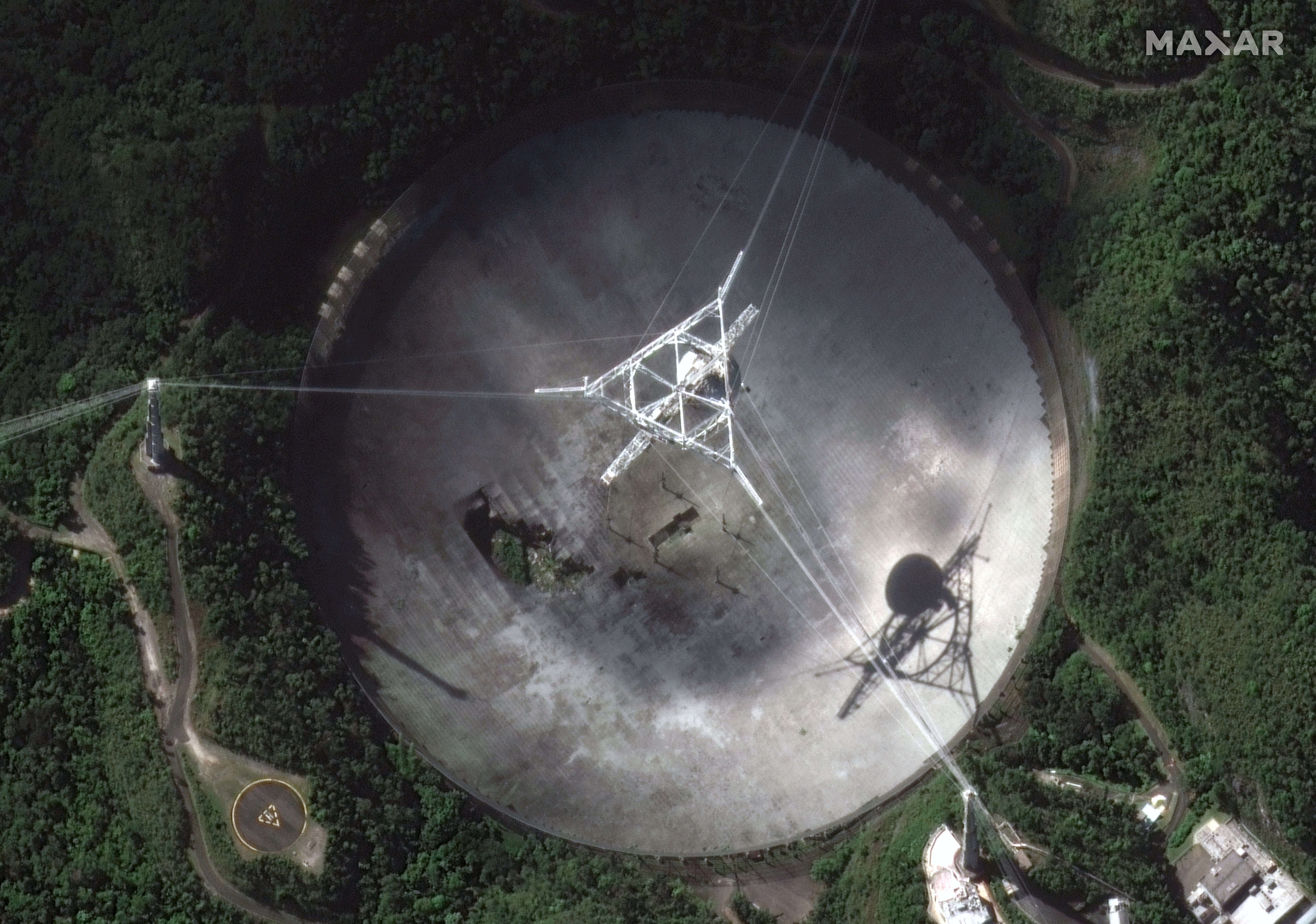 This satellite image provided by 2020 Maxar Technologies shows the damaged radio telescope at the A...