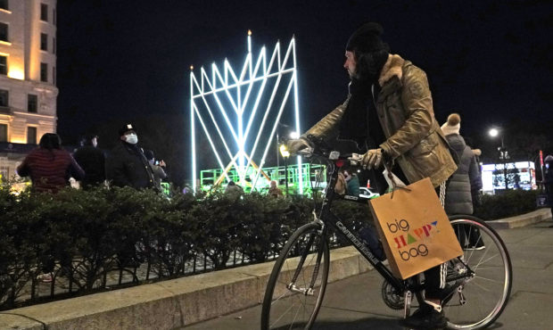 A man on a bicycle pauses on the sidewalk along Fifth Avenue in Manhattan near what has been descri...