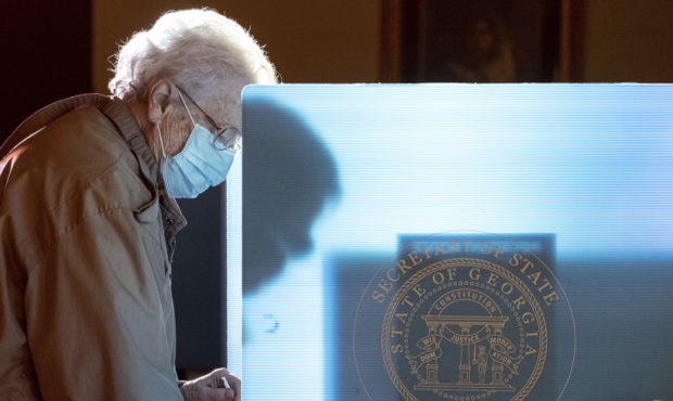 Helen Thomason marks her ballot at the Lawrenceville Road United Methodist Church in Tucker, Ga. du...