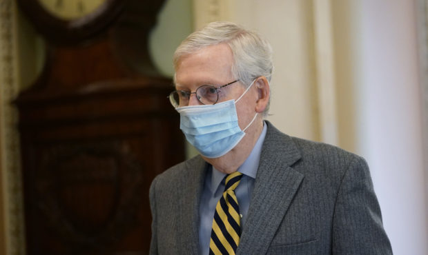FILE - In this Dec. 30, 2020, file photo Senate Majority Leader Mitch McConnell of Ky., walks to th...