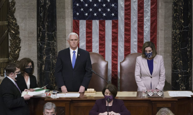 Vice President Mike Pence and Speaker of the House Nancy Pelosi, D-Calif., read the final certifica...