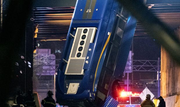 A bus in New York City which careened off a road in the Bronx neighborhood of New York and is left ...