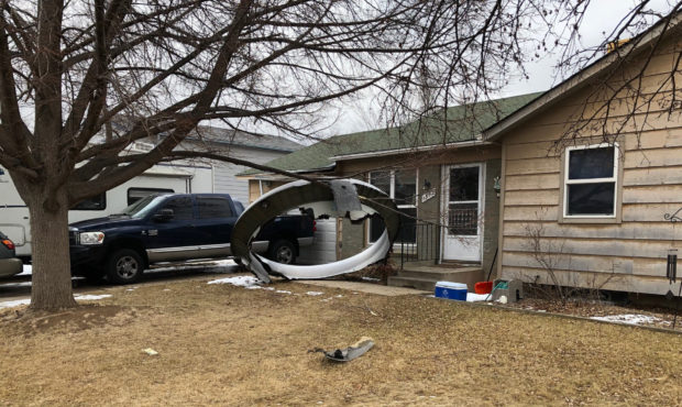 In this photo provided by the Broomfield Police Department on Twitter, debris is scattered in the f...