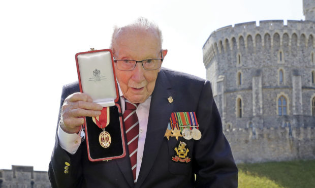 FILE - In this Friday, July 17, 2020 file photo, Captain Sir Thomas Moore poses for the media after...