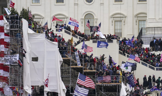 FILE - In this Jan. 6, 2021, file photo rioters loyal to President Donald Trump storm the U.S. Capi...
