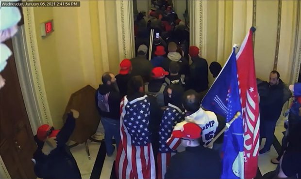 In this image from video, security video is shown to senators as House impeachment manager Rep. Eri...