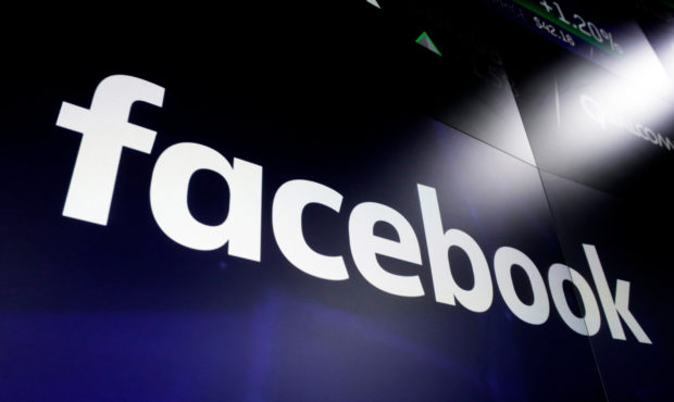 FILE - This March 29, 2018, file photo shows the Facebook logo on screens at the Nasdaq MarketSite,...