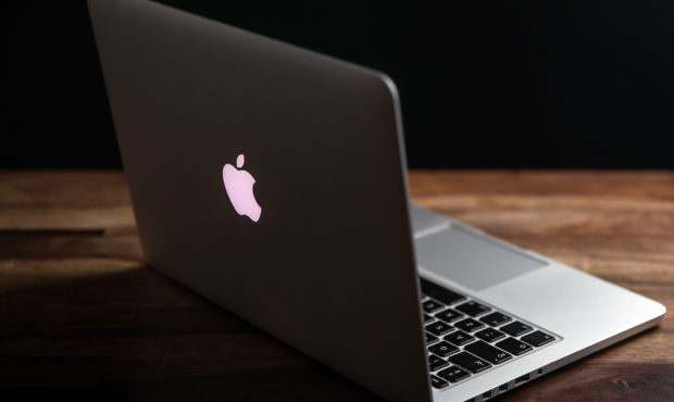 CRACOW, POLAND - 2020/12/01: In this photo illustration a 13inch Macbook pro seen displayed on a wo...