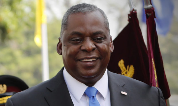 FILE - In this Saturday, March 20, 2021 file photo, U.S. Defense Secretary Lloyd Austin reviews an ...