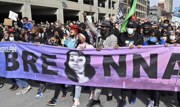 Tamika Palmer, center, the mother of Breonna Taylor, leads a march through the streets of downtown ...