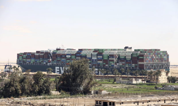 Ever Given, a Panama-flagged cargo ship blocks the Suez Canal almost a week after it got stuck side...