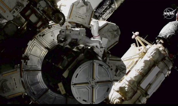 In this image provided by NASA shows NASA astronauts Victor Glover and Mike Hopkins on a spacewalk ...