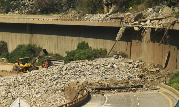 Colorado Department of Transportation crews work to clear I-70 in Glenwood Canyon after the interst...