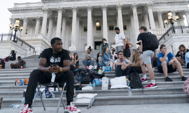 Supporters of Rep. Cori Bush, D-Mo., camp with her outside the U.S. Capitol, in Washington, Monday,...