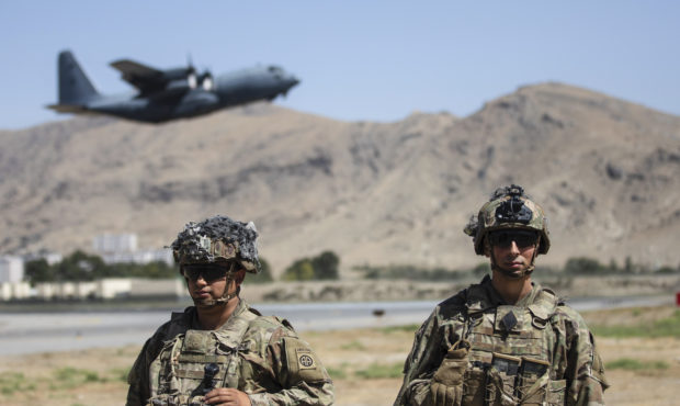 In this image provided by the Department of Defense, two paratroopers assigned to the 1st Brigade C...