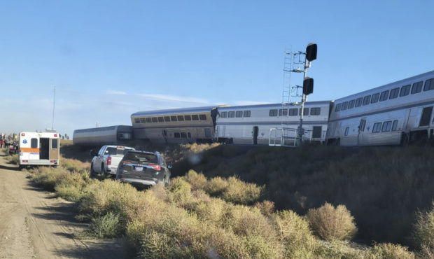 In this photo provided by Kimberly Fossen an ambulance is parked at the scene of an Amtrak train de...