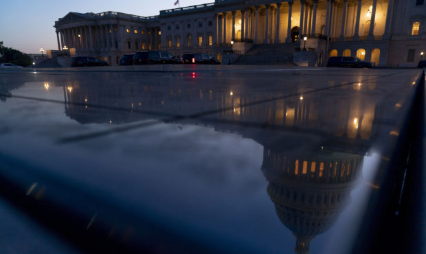 The U.S Capitol is visible after sunset in Washington, Thursday, Sept. 30, 2021. With only hours to...