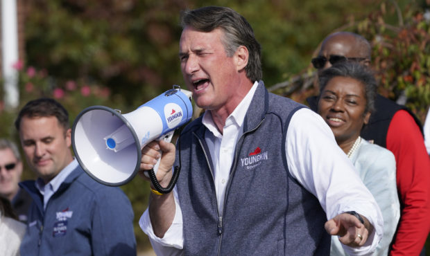 Republican gubernatorial candidate Glenn Youngkin, center, speaks to supporters as running mates At...