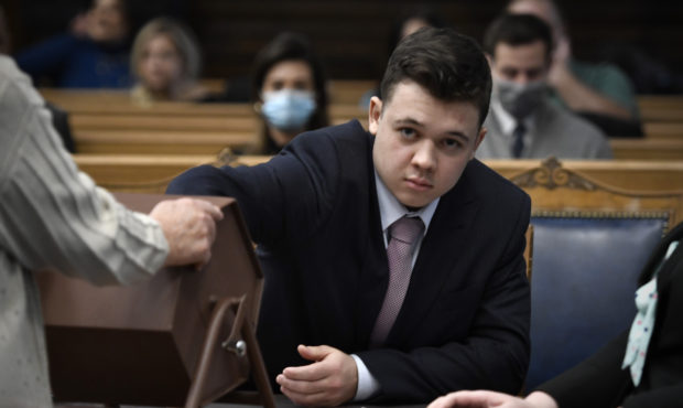 Kyle Rittenhouse pulls numbers of jurors out of a tumbler during his trial at the Kenosha County Co...