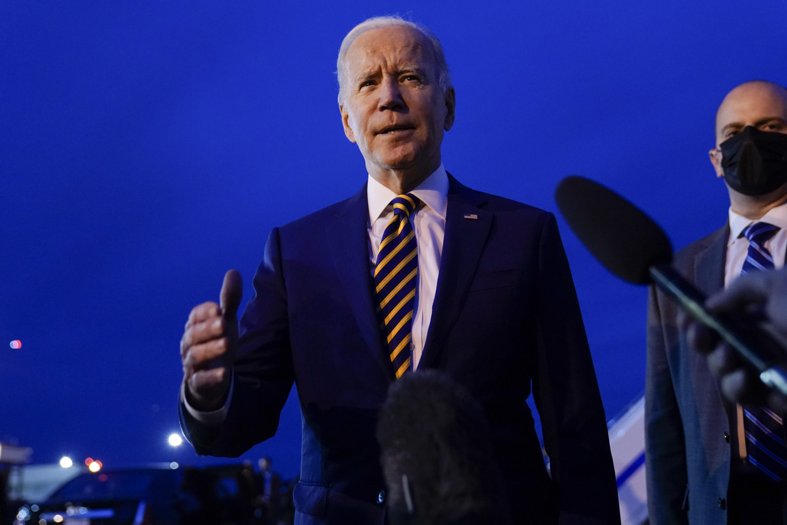 President Joe Biden speaks to members of the media before boarding Air Force One at Minneapolis-Sai...