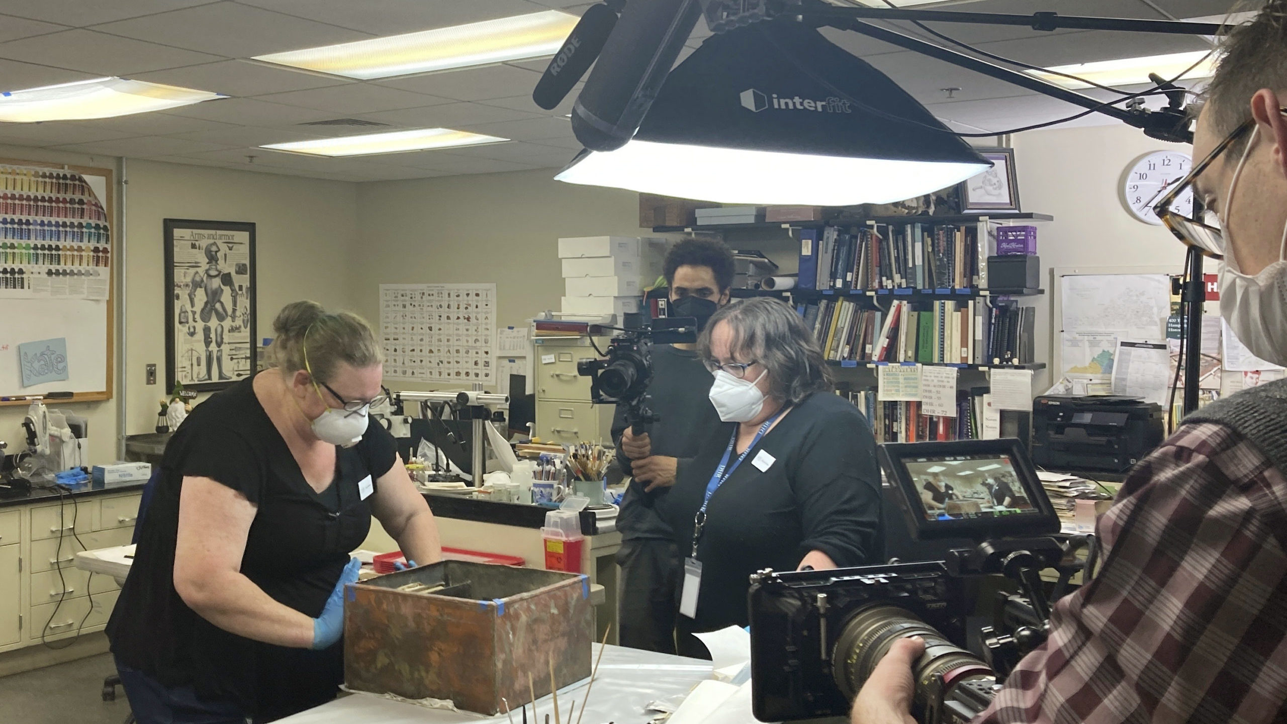 Conservators work on a box believed to be a time capsule left in the pedestal at the former site of...