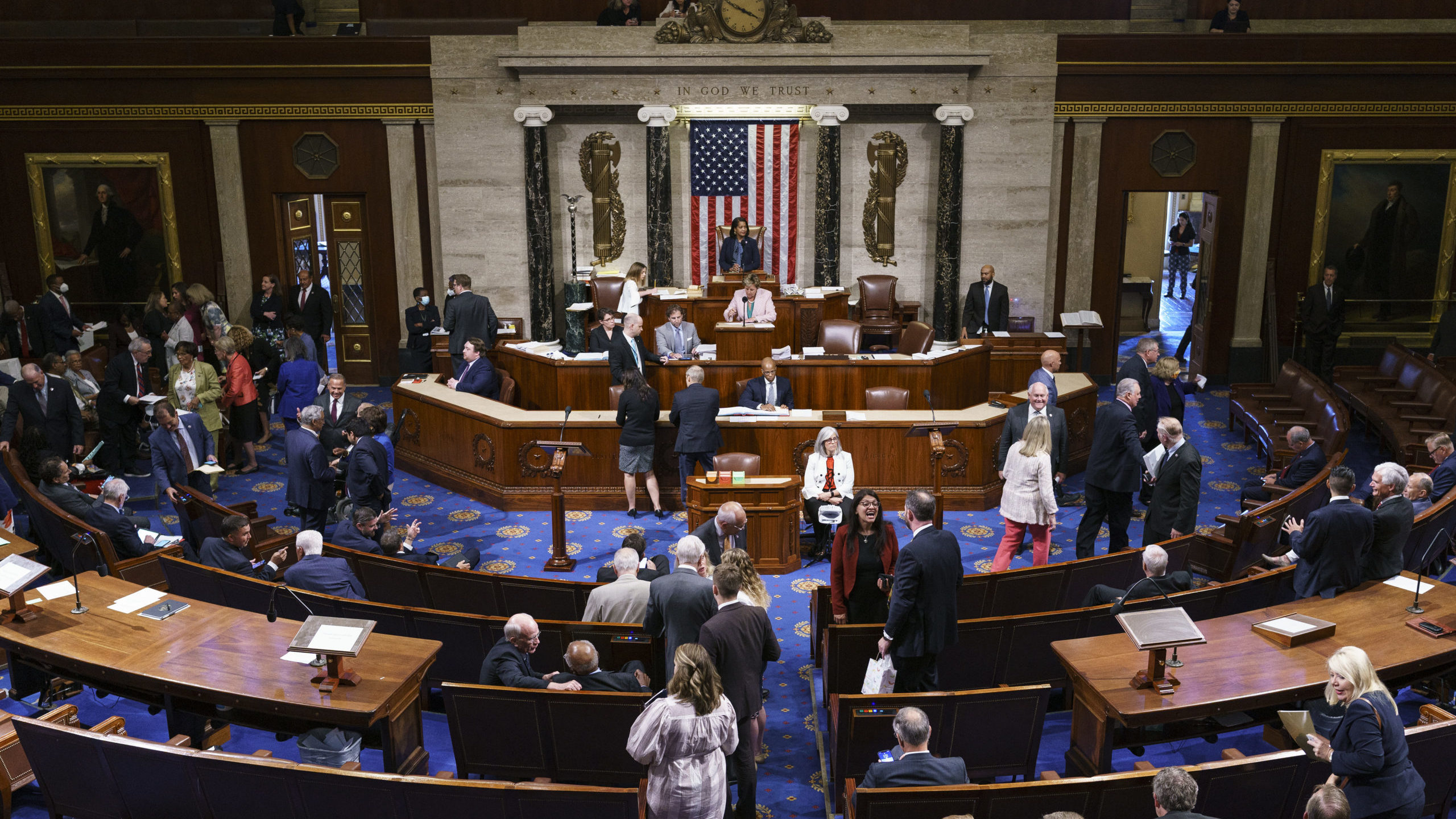 FILE - Members of the House of Representatives gather in the chamber to vote on creation of a selec...