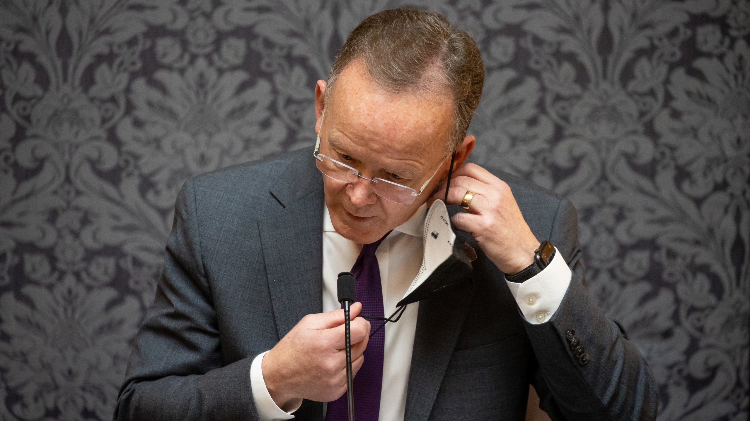 Senate President Stuart Adams, R-Layton, removes his mask while presiding in the Senate chamber at ...