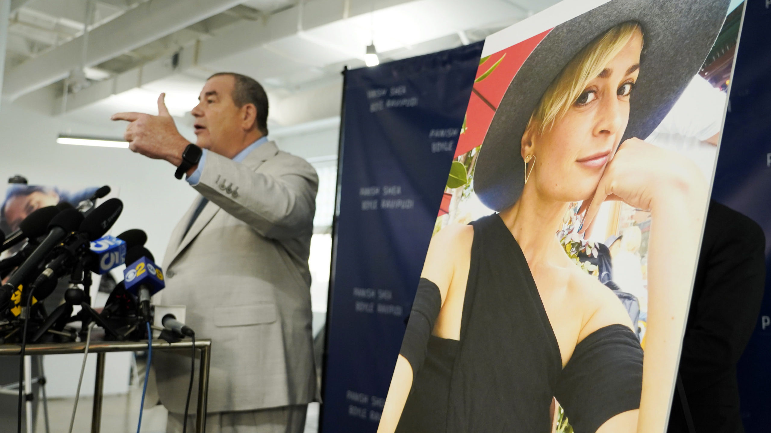 Brian Panish, left, an attorney for the family of late cinematographer Halyna Hutchins, speaks next...