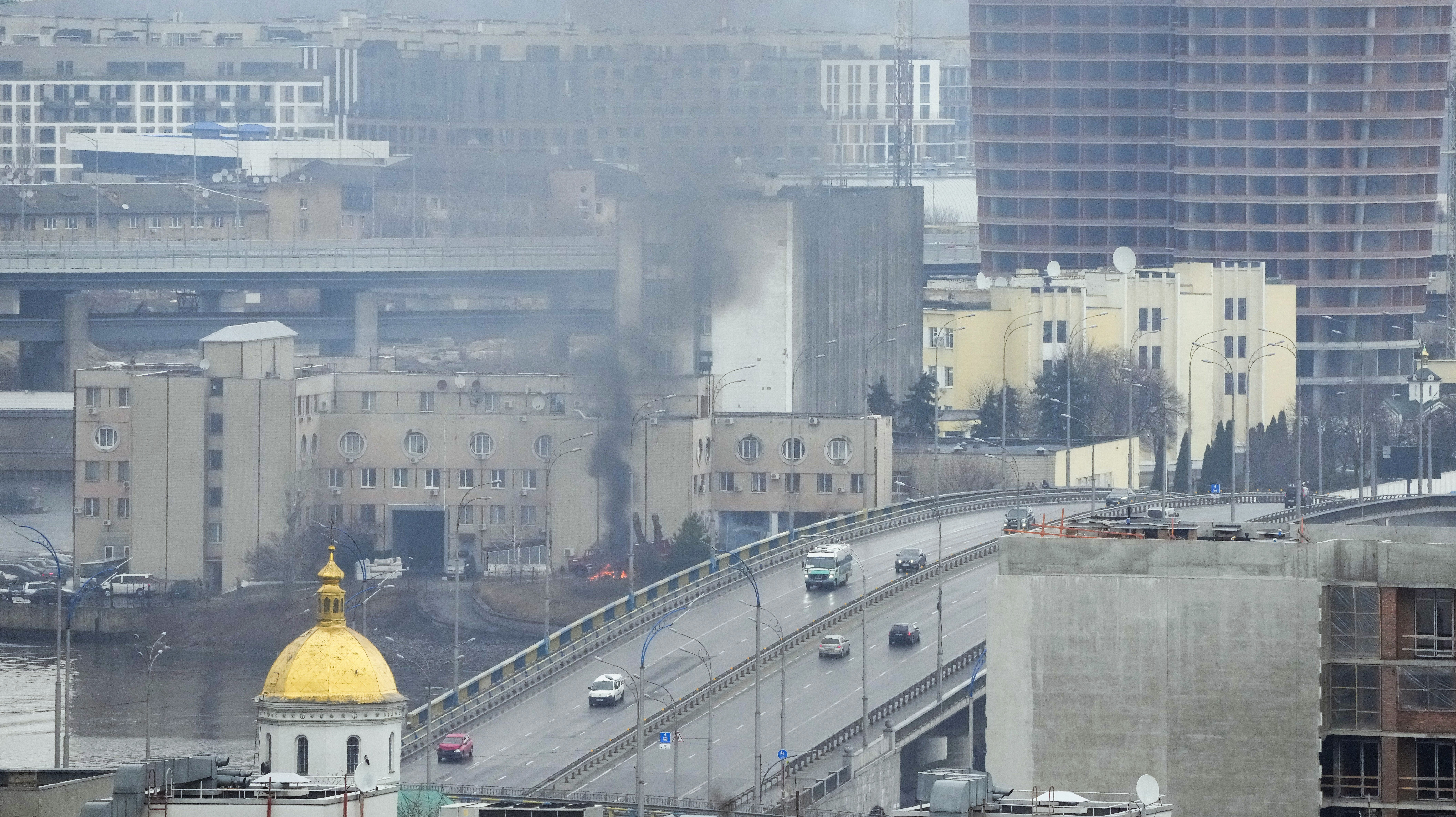 Smoke and flame rise near a military building after an apparent Russian strike in Kyiv, Ukraine, Th...
