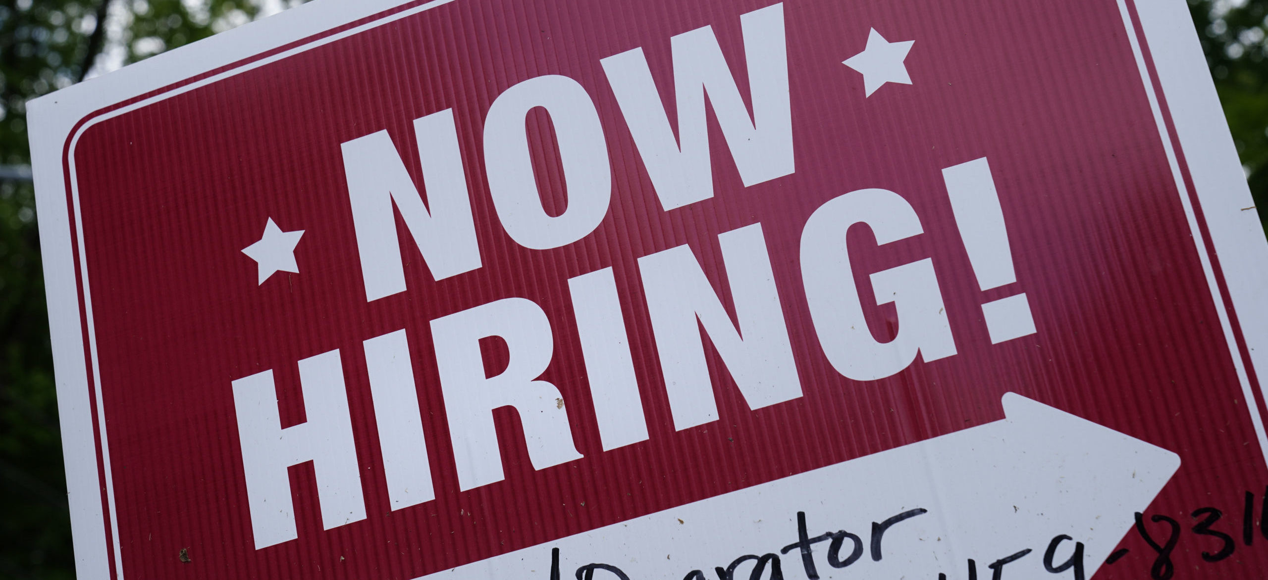 FILE - A "now hiring" sign is posted in Garnet Valley, Pa., Monday, May 10, 2021.  Job openings sta...