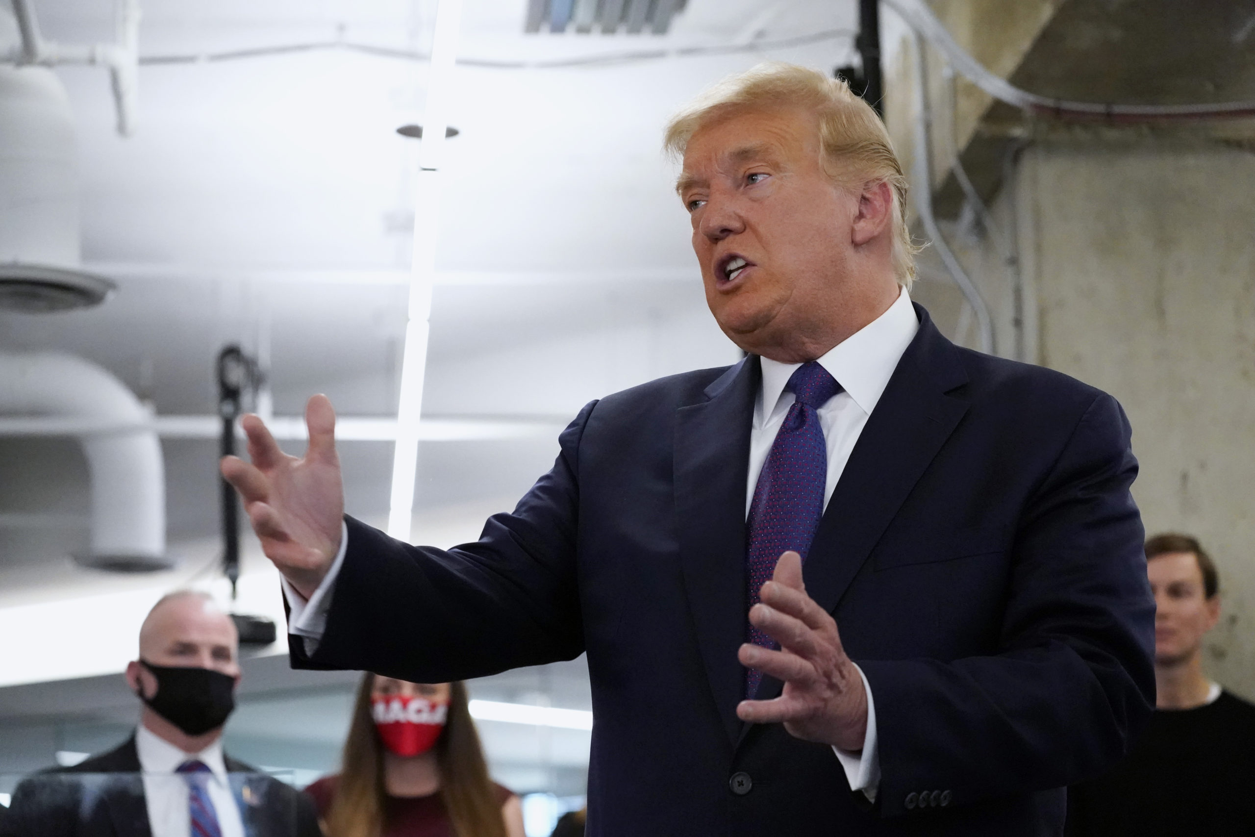Former President Donald J. Trump speaking and making hand gestures...