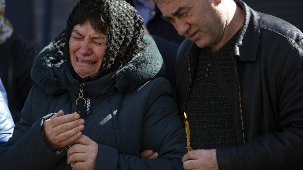 Relatives mourn the dead of Oleksandr Mozheiko, 31, territorial defense soldier who was killed by R...