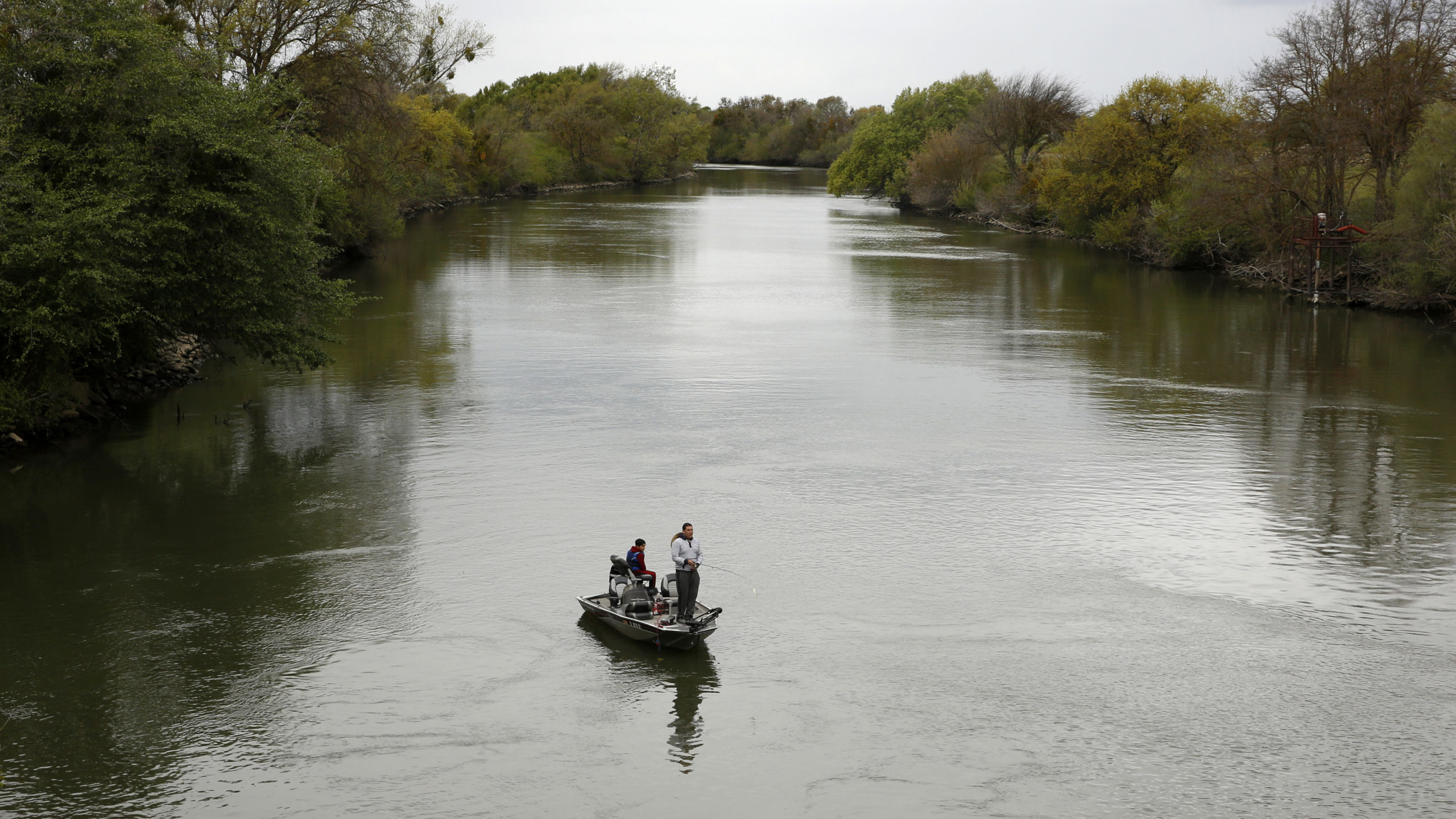 FILE - People fish in the Sacramento-San Joaquin River Delta's Elk Slough near Courtland, Calif., T...