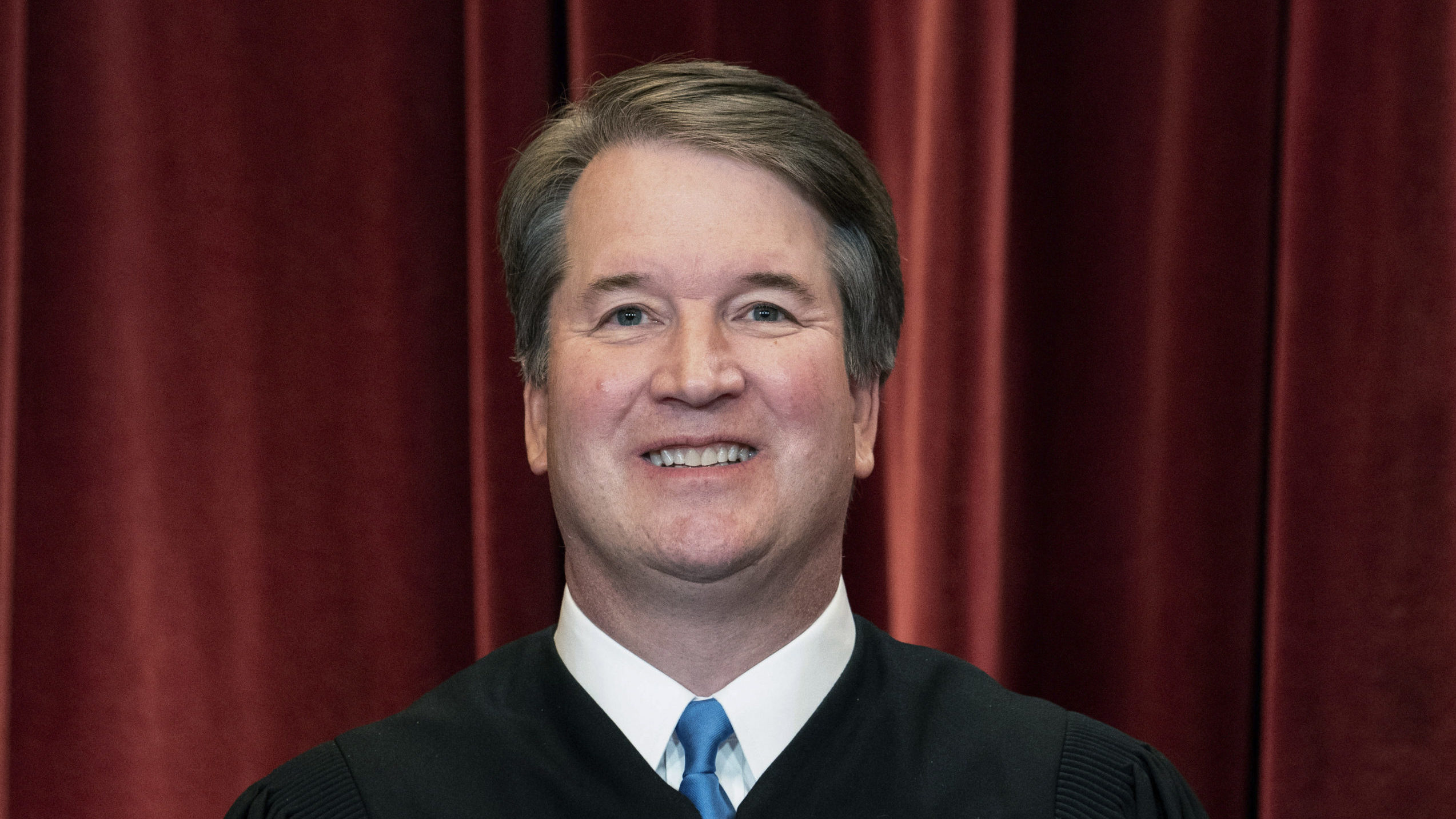 FILE - Associate Justice Brett Kavanaugh stands during a group photo at the Supreme Court in Washin...