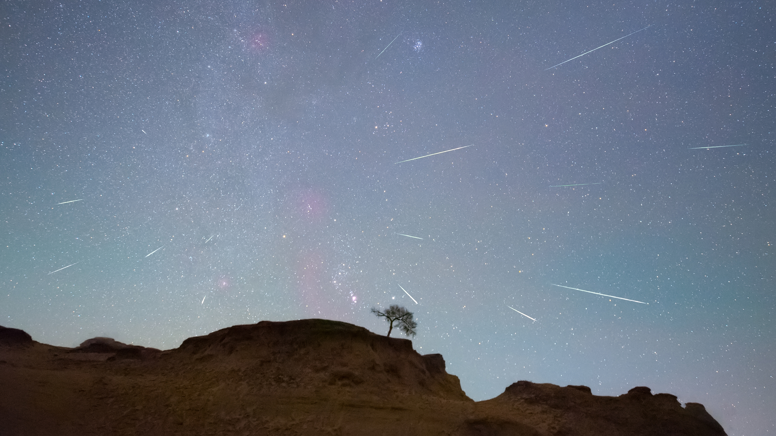 DAQING, CHINA - OCTOBER 22, 2020 - The Orionids meteor shower is seen over the Songhua River in Daq...