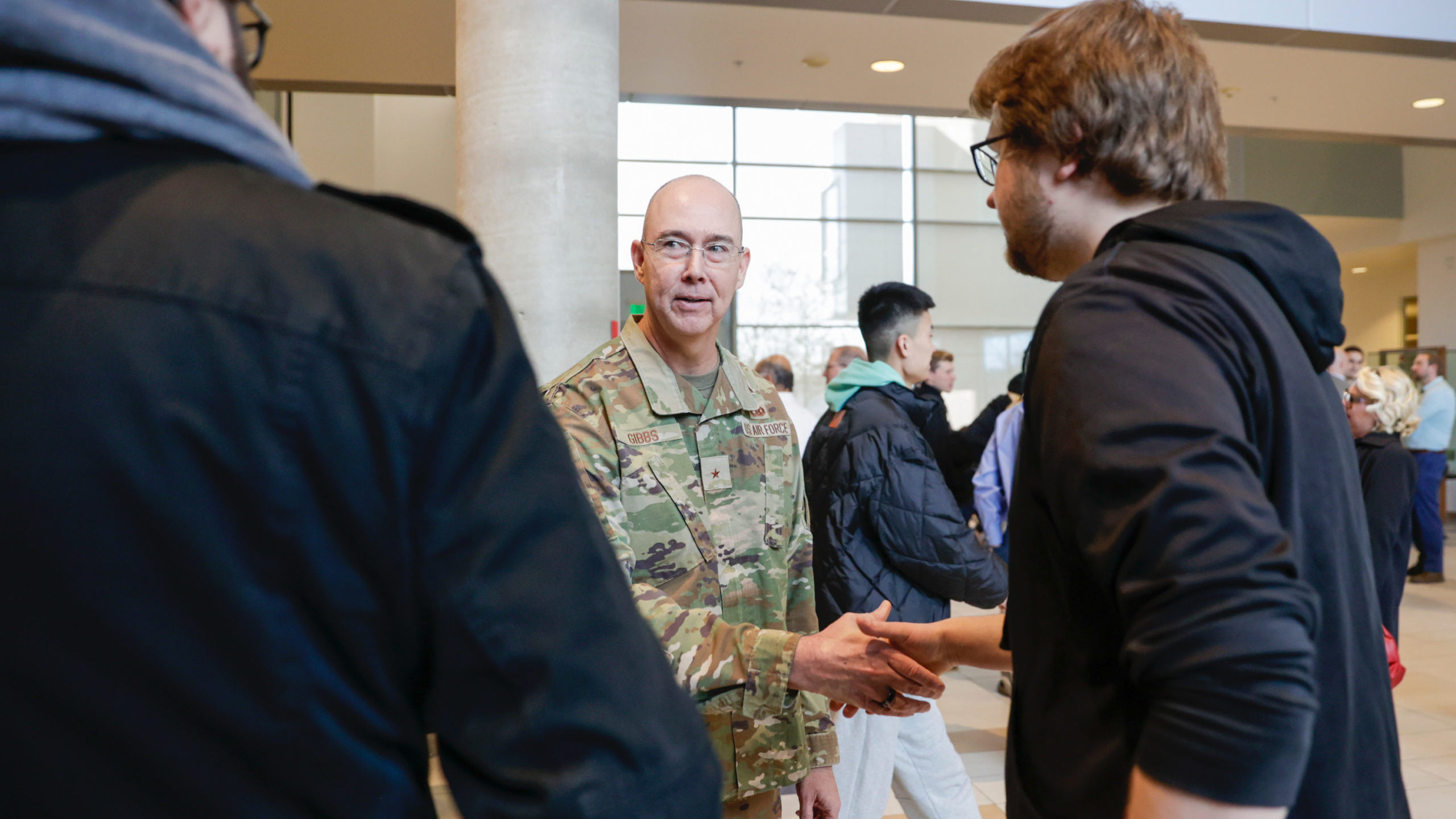 Brig. Gen. Richard W. Gibbs, center, speaks with University of Utah students before a press confere...