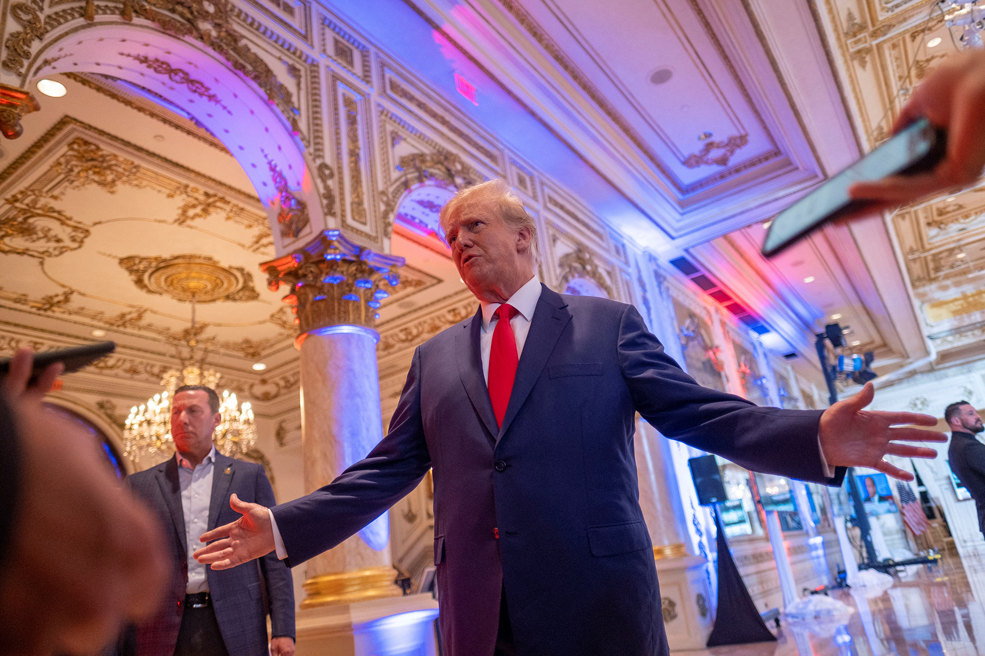 Former U.S. President Donald Trump talks to the press on the grounds of his Mar-a-Lago resort on mi...