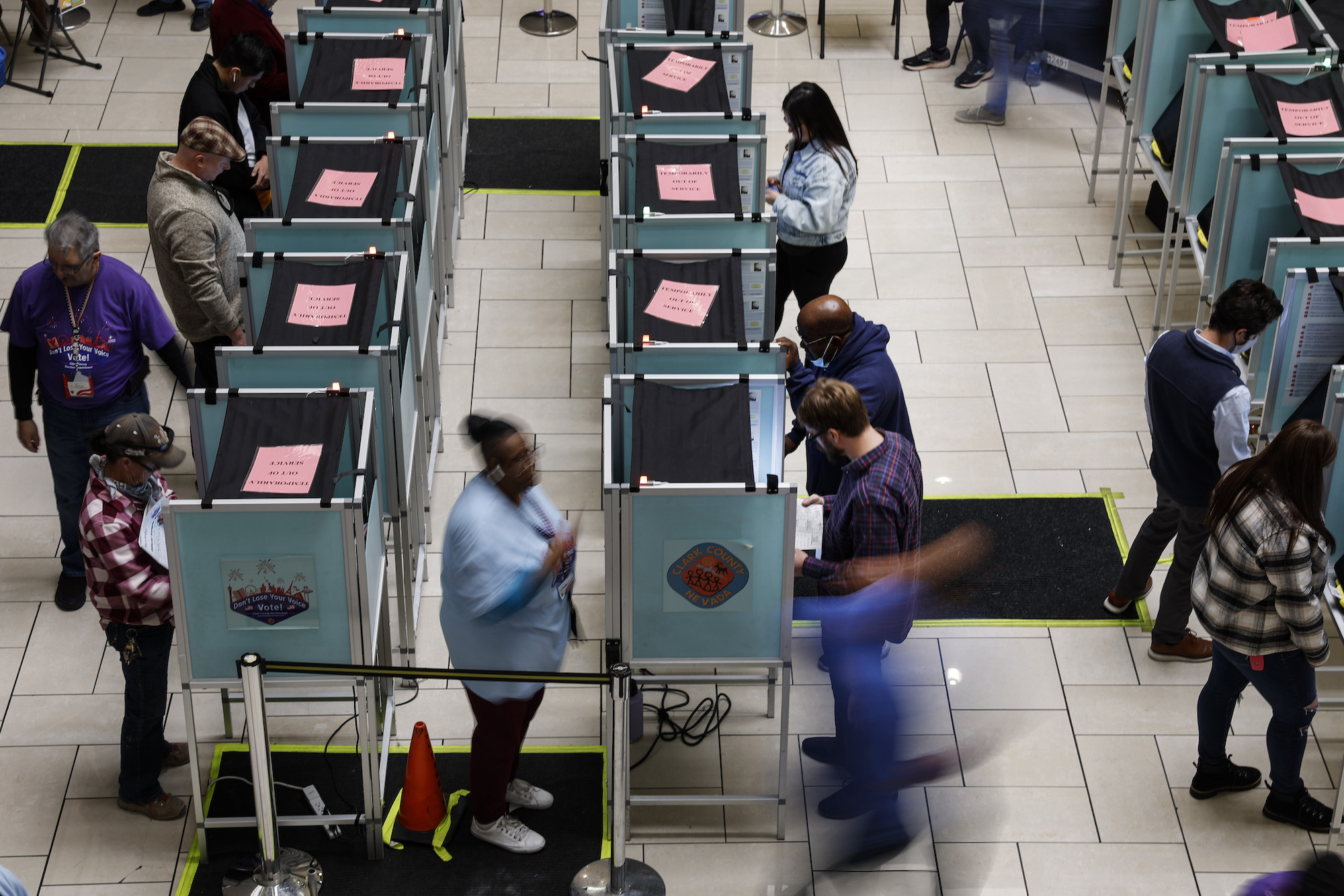 LAS VEGAS, NEVADA - NOVEMBER 08: Voters stand in voting booths as they fill out their ballots at a ...