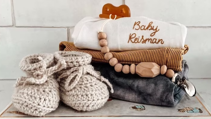 a baby onesie similar to the one seen on meghan markle and harry's daughter...