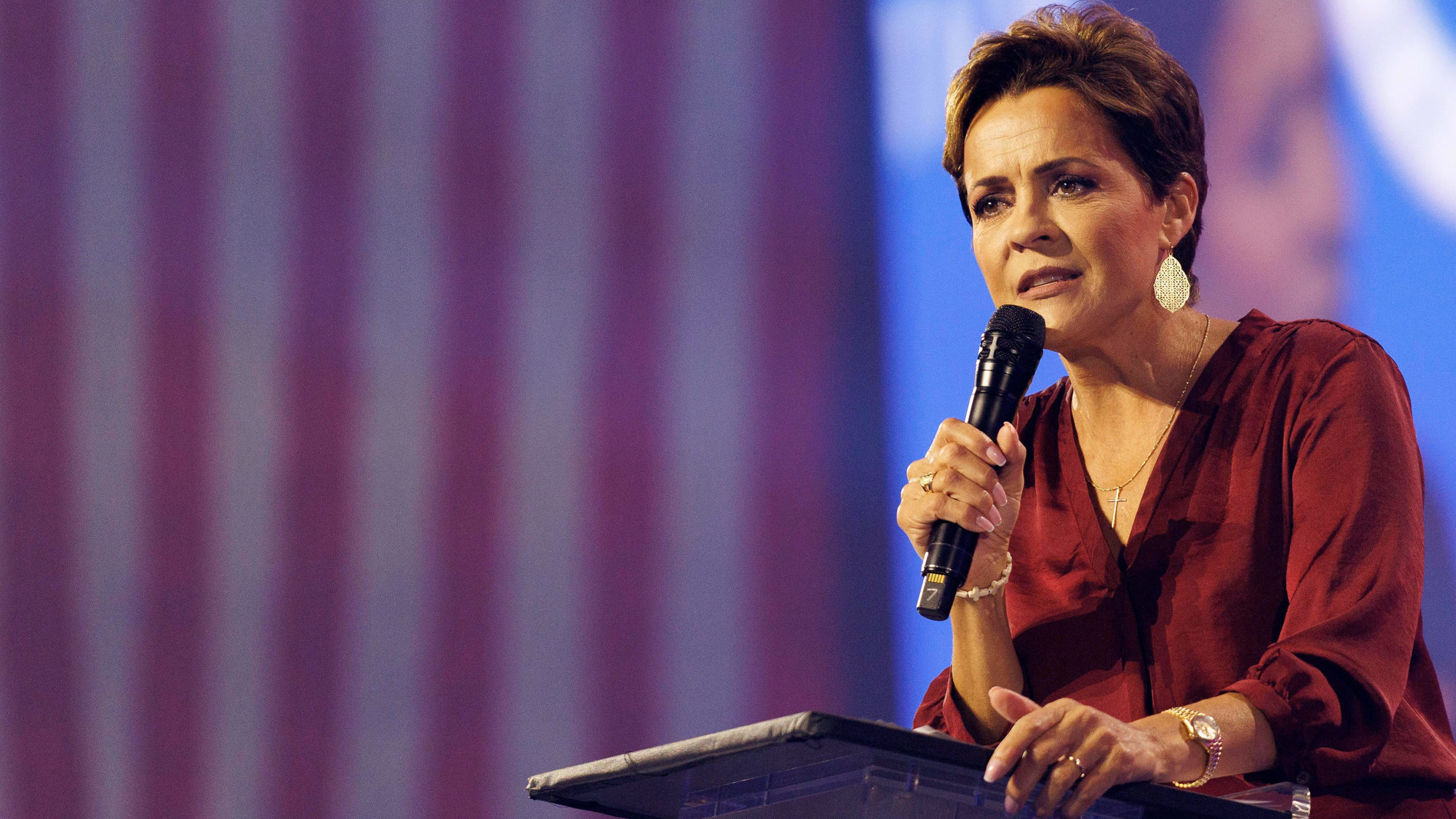 Arizona judge orders Republican Kari Lake, pictured here, in Phoenix on December 18 to pay fees for...