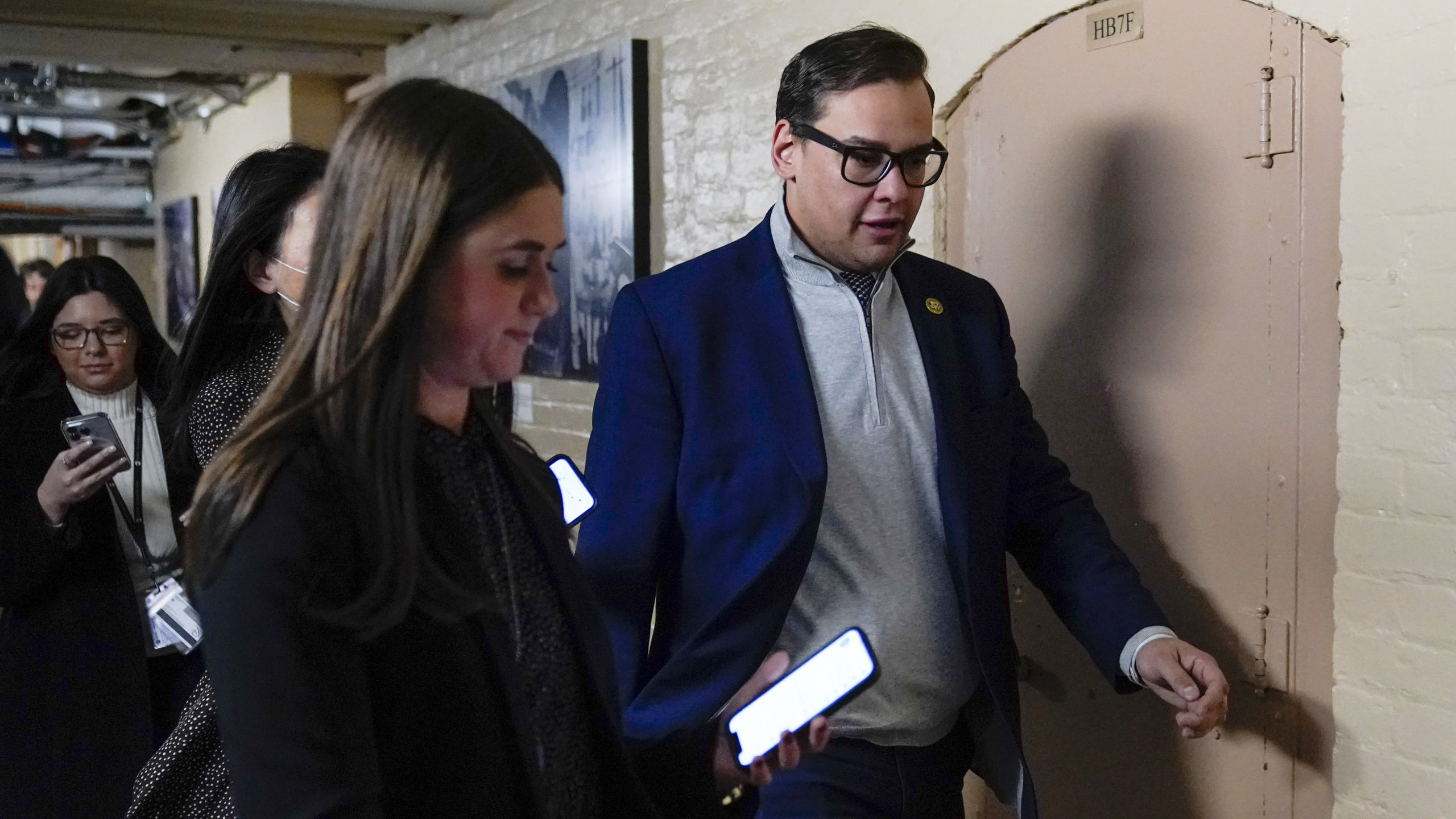 Rep. George Santos, R-N.Y., departs after attending a House GOP conference meeting on Capitol Hill ...