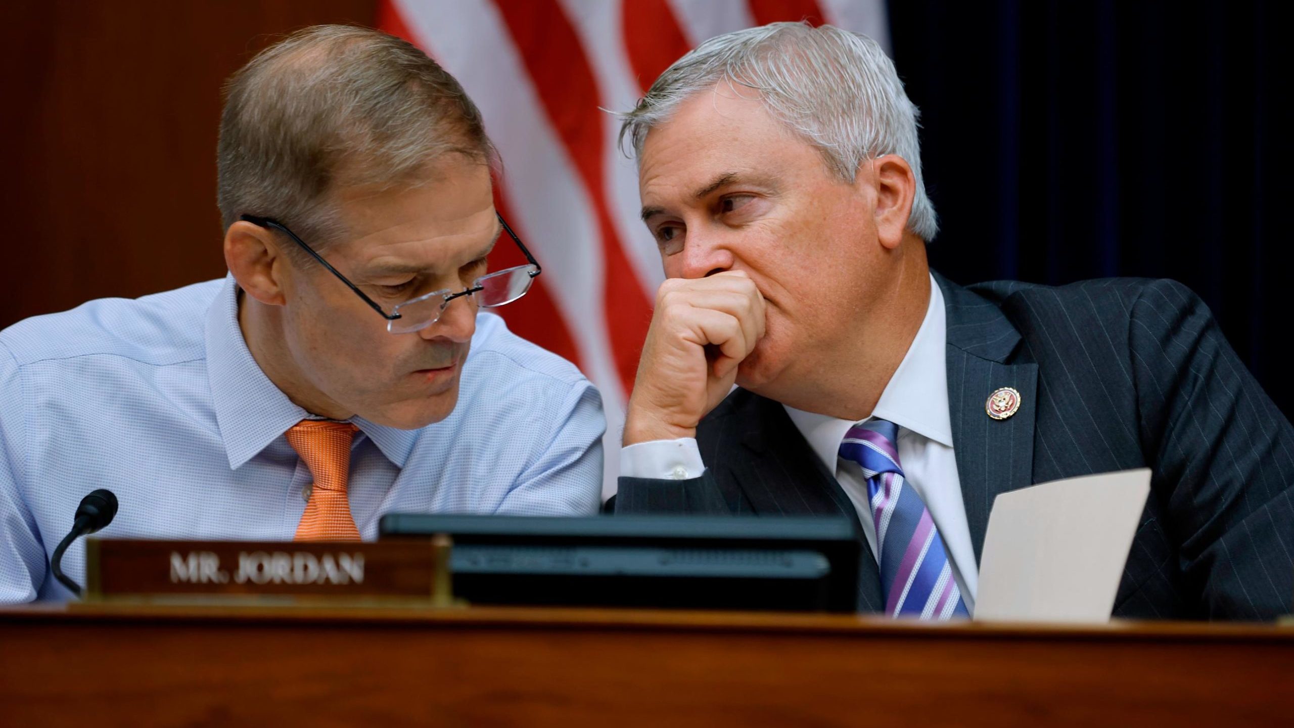 Reps. Jim Jordan of Ohio (left) and James Comer of Kentucky talk during a hearing on Capitol Hill i...