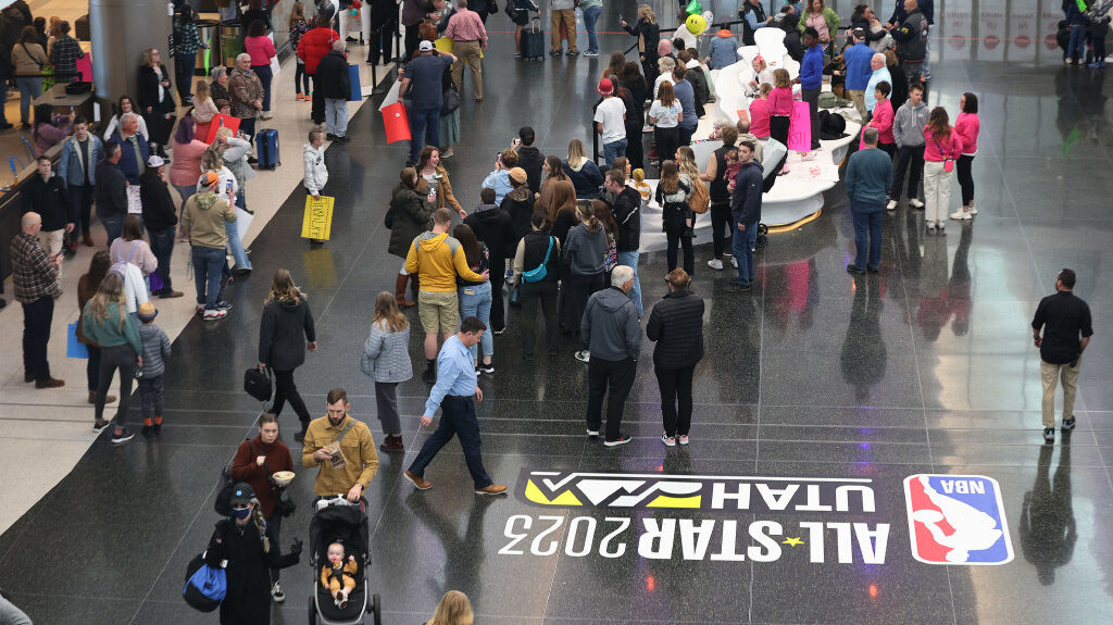 Crowds wait and exit the Salt Lake City International Airport in Salt Lake City on Wednesday, Feb. ...
