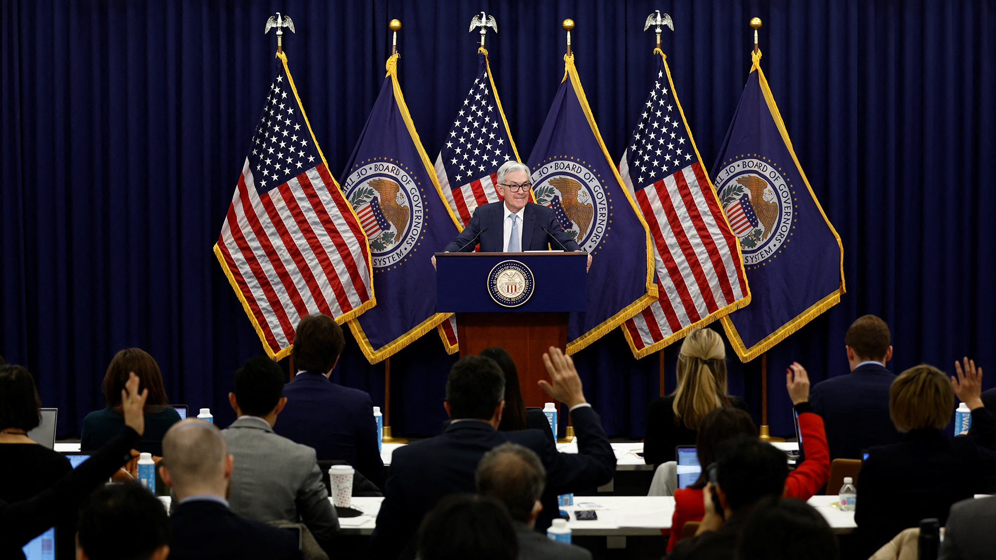 The Federal Reserve unanimously approved a quarter-point interest rate hike Wednesday, slowing the ...