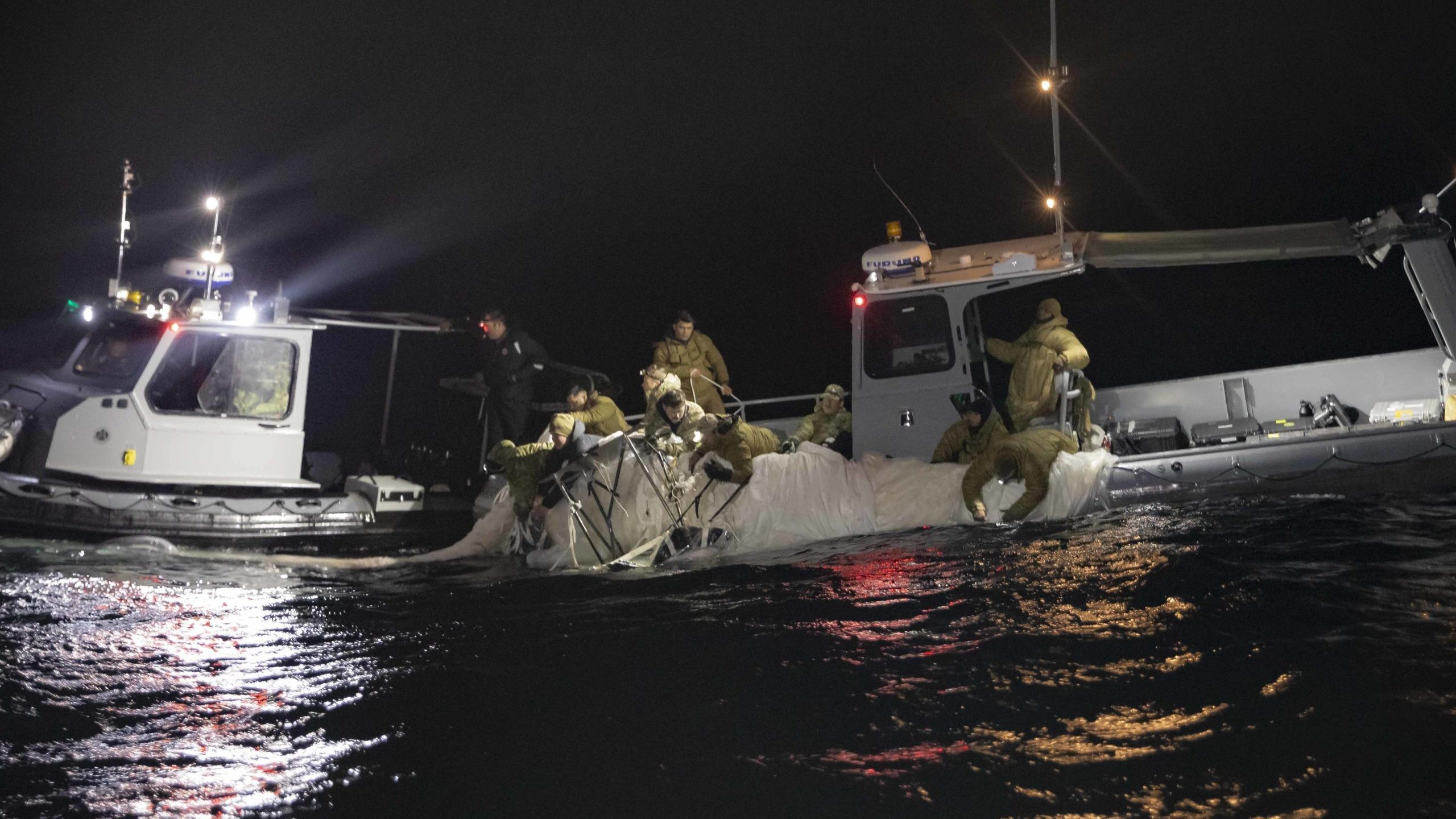 MYRTLE BEACH, SC - FEBRUARY 05: Sailors assigned to Explosive Ordnance Disposal Group 2 recover a h...